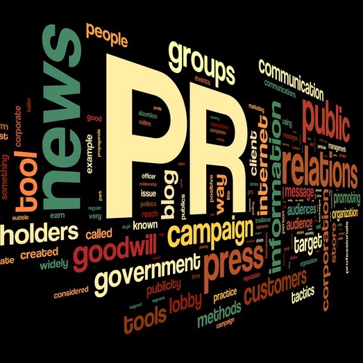 Public relations concept in word tag cloud on black background